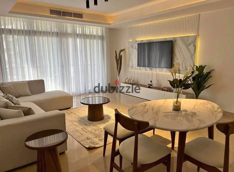 للاستلام فوري شقة للبيع متشطبه بالكامل بفيو علي البرج الايقوني بموقع ساكن و متكامل الخدمات في العاصمة الادارية 0