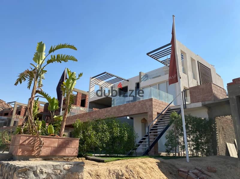 شاليه للبيع بالمطبخ والتكييفات فيو عالبحر ارضى بجاردن بمنتجع ذا جروف في العين السخنة استلام فورى 0