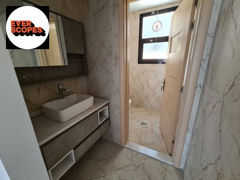 شقة للبيع تشطيب كامل اميز لوكيشن في العاصمة الادارية الجديدة امام البرج الايقوني 0