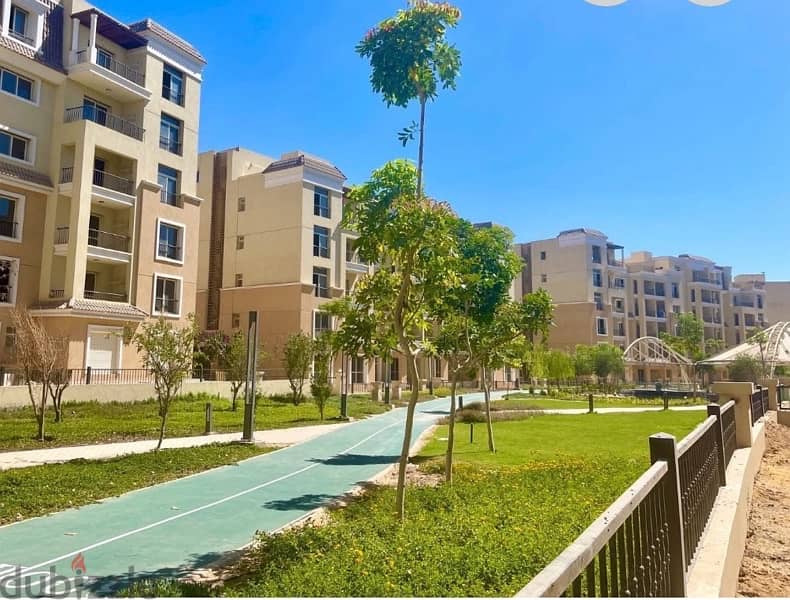 شقة أرضى بحديقة كمبوند سراى 0