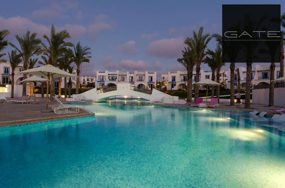 أقل سعر تاون هاوس ميدل للبيع في إيفيا ماونتن فيو رأس الحكمة – برايم لوكيشن دايركت على اللاجون – استلام 2027 وتقسيط حتى 2031 0